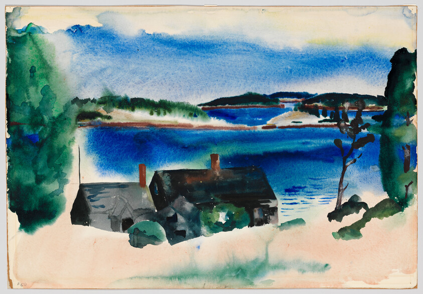 A small dark house sits on a shoreline with blue water and distant tree-lined islands.