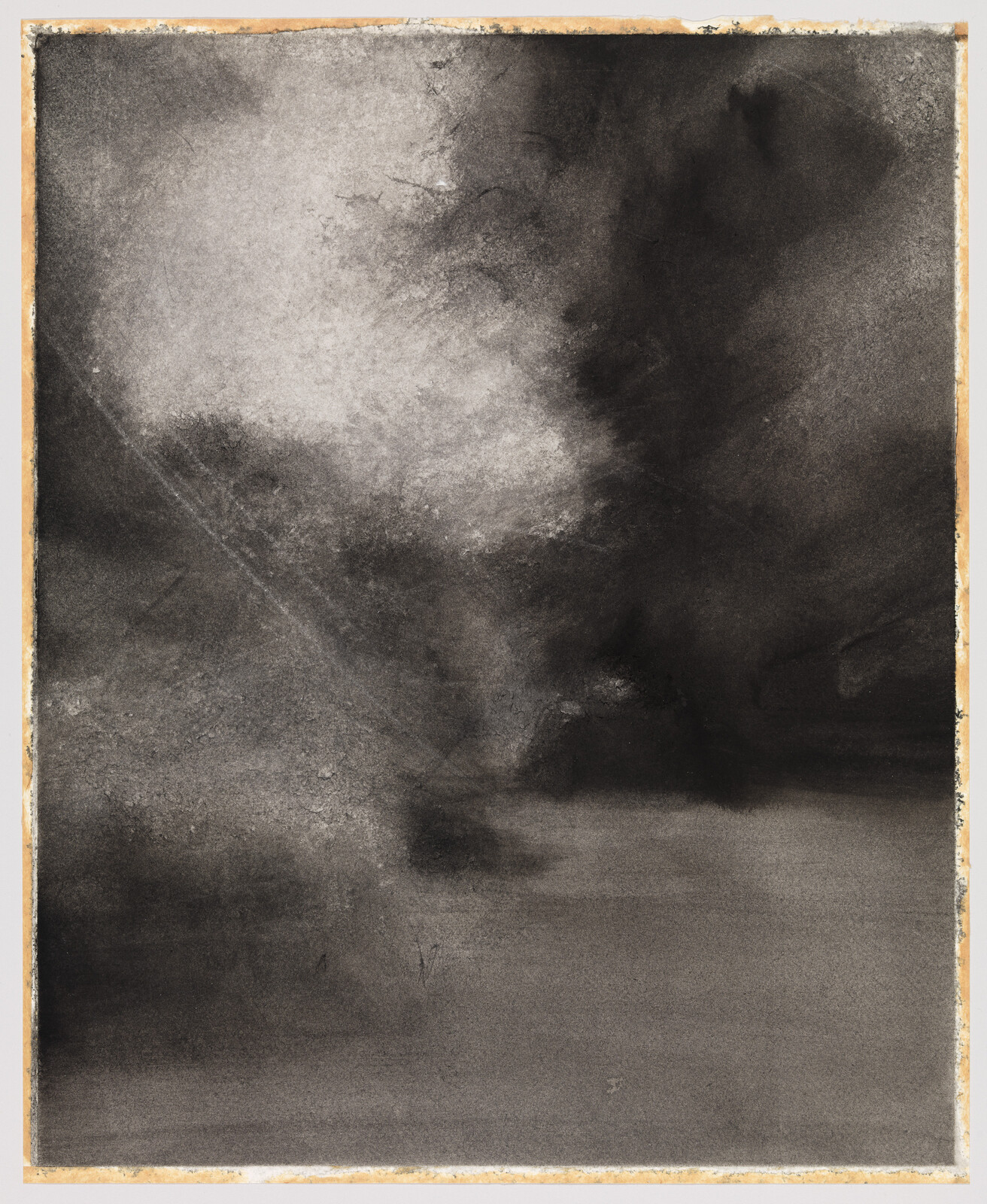 An abstract monochromatic artwork with a gradient of black to gray tones, resembling a smoky or cloudy texture, framed with a thin, light border. The image has a rough, textured appearance, with areas of lighter gray that seem to illuminate the composition from within.