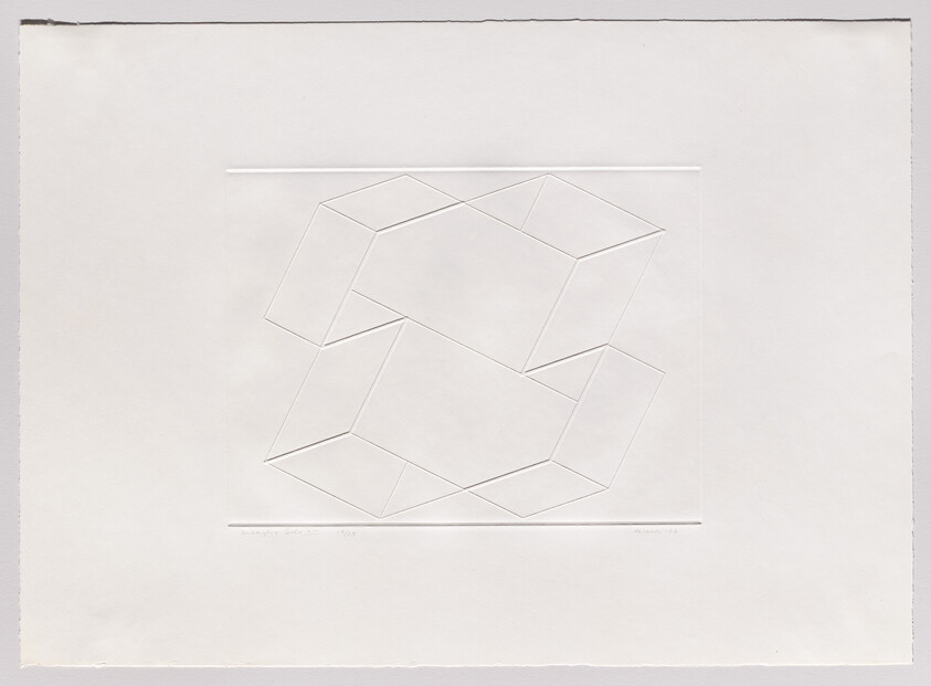 Two interlocking embossed cube shapes outlined by faint raised lines on a large white paper sheet.