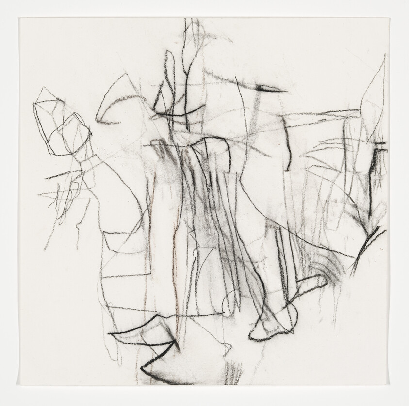 Loose charcoal lines and smudges form an abstract, vertical composition suggesting figures and architectural shapes.