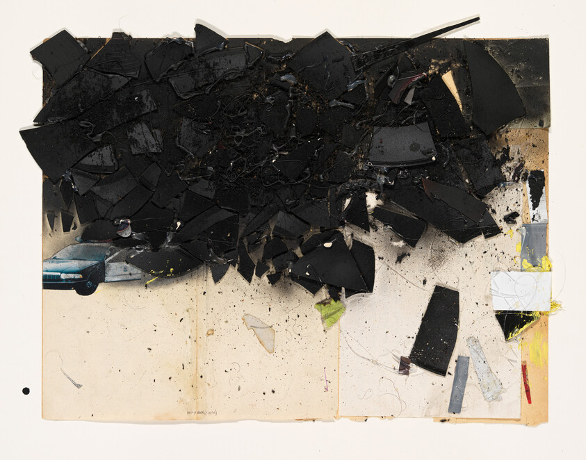 A mixed media artwork featuring a collage of various materials, predominantly in black, on a beige background. The composition includes shattered pieces that appear to be layered and textured, with some elements resembling electronic components and wires. A small, partially visible image of a blue car is on the left, and there are splashes of yellow and red paint along the right edge. The piece has a rough, distressed look with a sense of chaotic fragmentation.