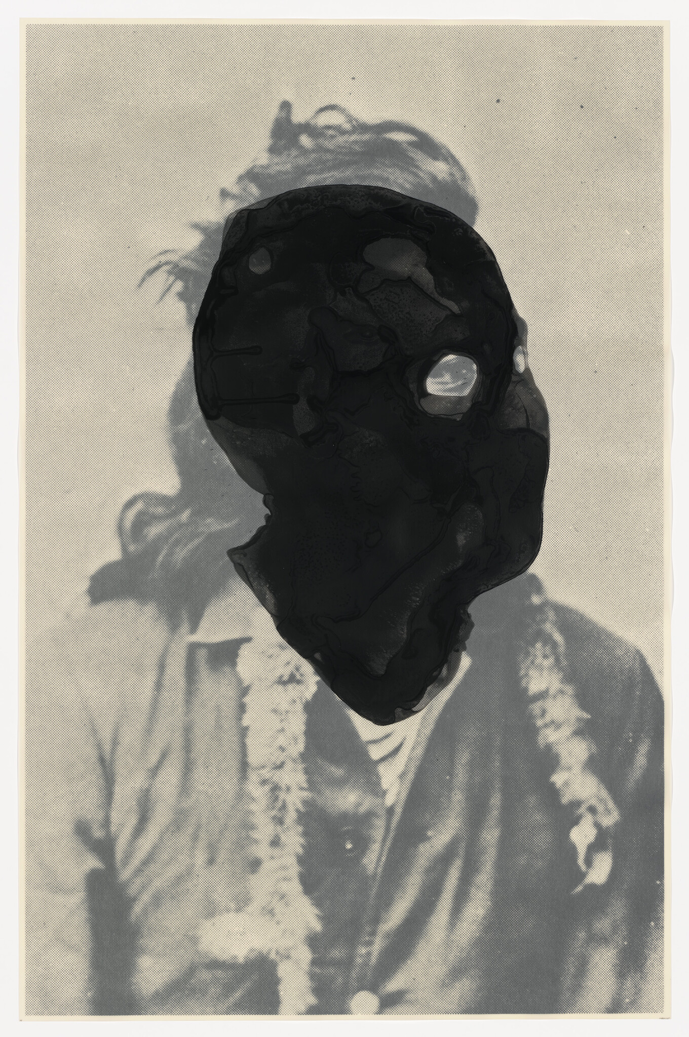 A vintage portrait of a person whose face is obscured by a large black ink blot.
