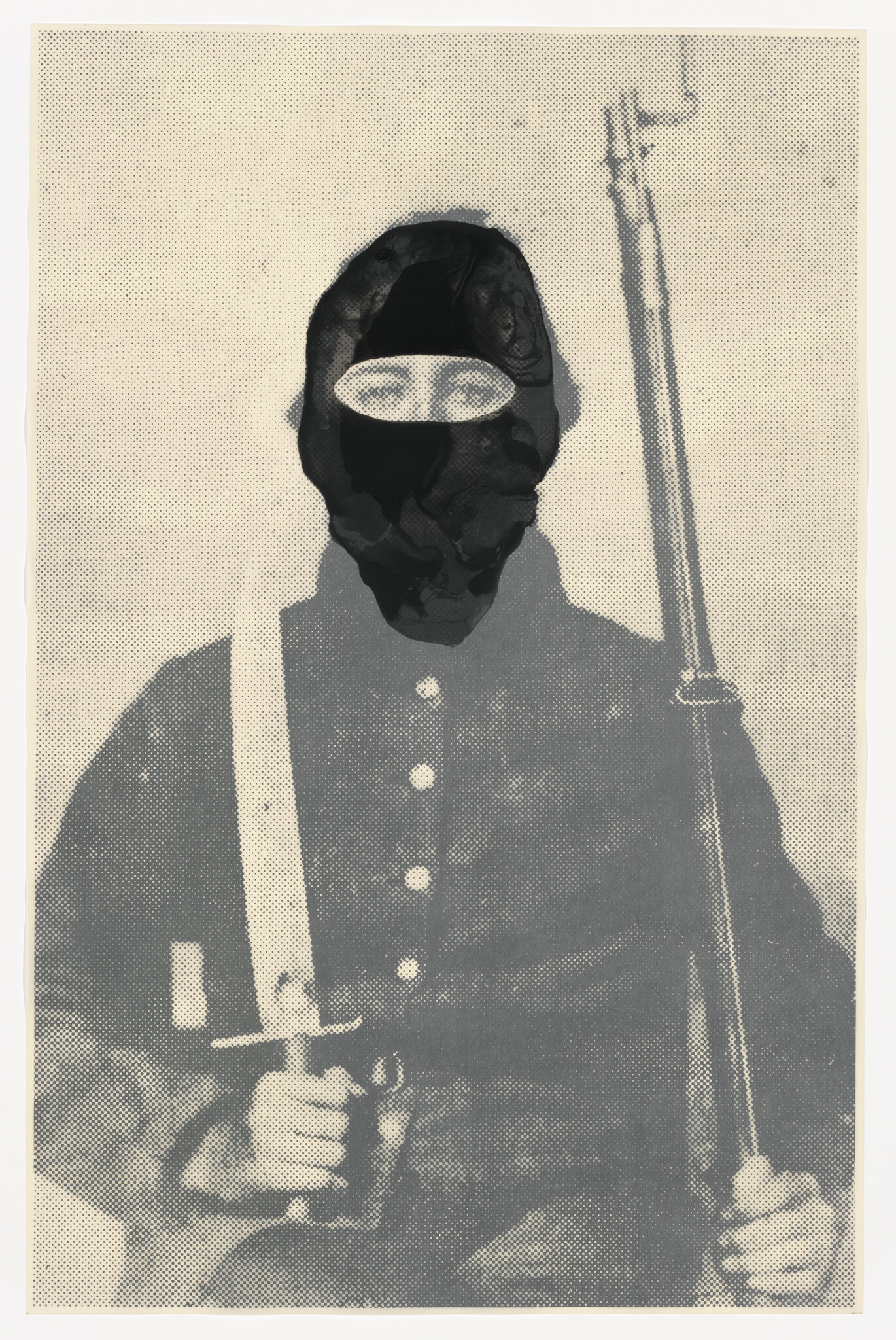 A masked soldier in uniform holds a rifle vertically and grips a bayonet across his lap.
