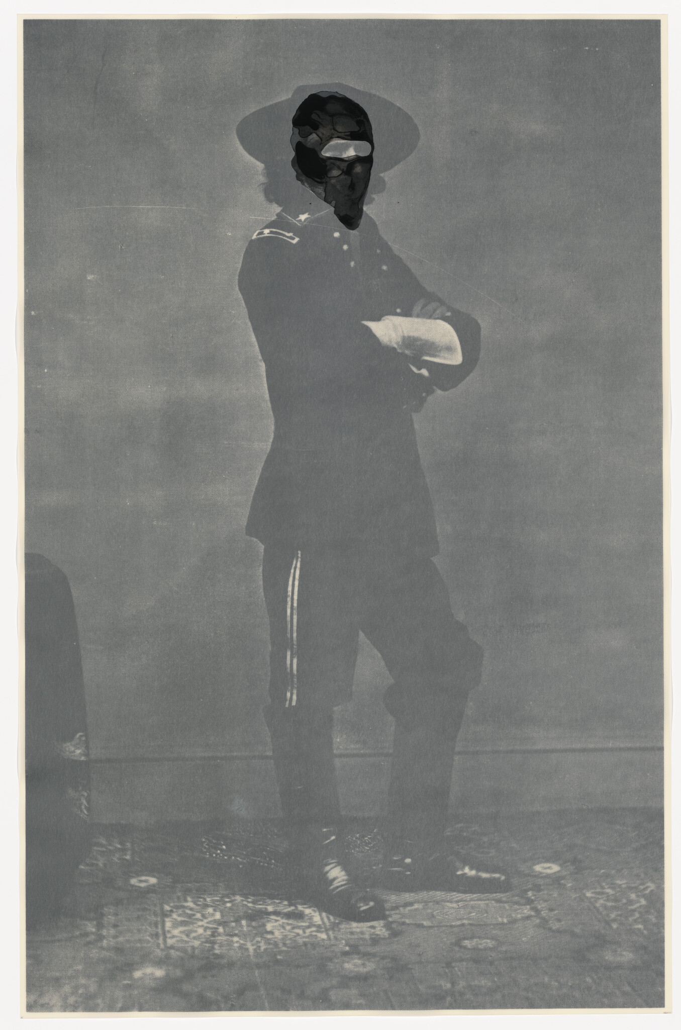 A uniformed man stands with arms crossed wearing a wide-brimmed hat and boots.