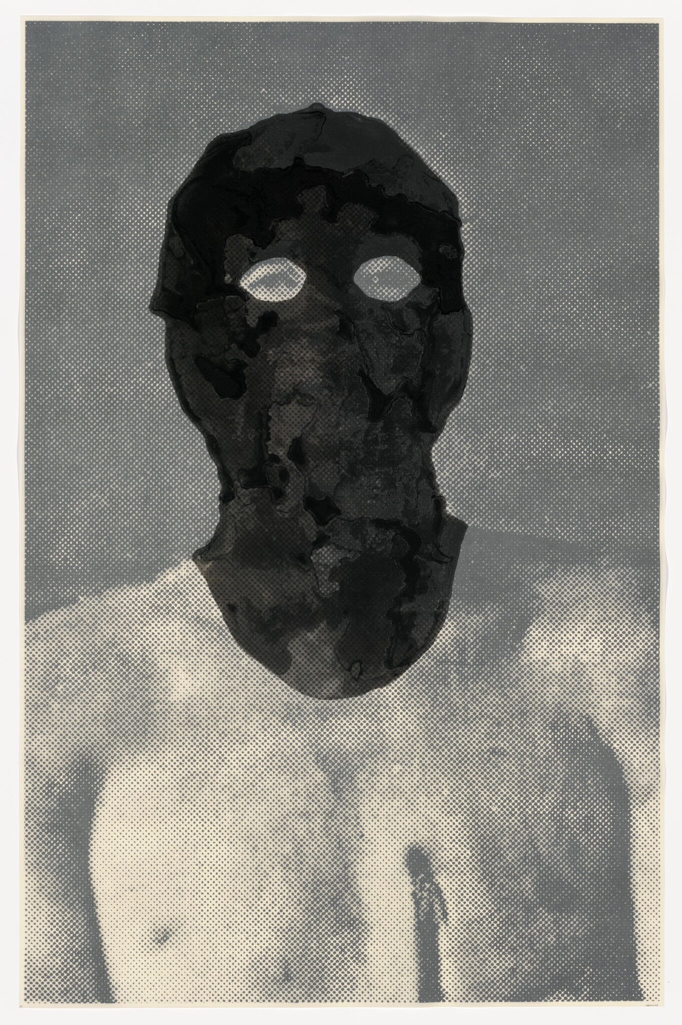 A shirtless person wearing a dark mask with white eye holes facing forward.