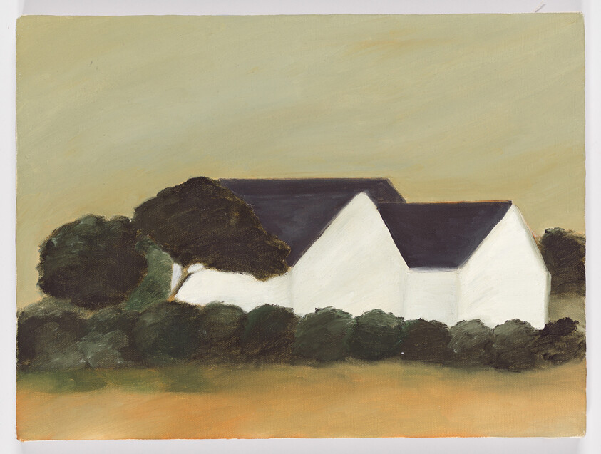 A row of white farmhouse buildings with dark roofs sits behind trees and low shrubs.