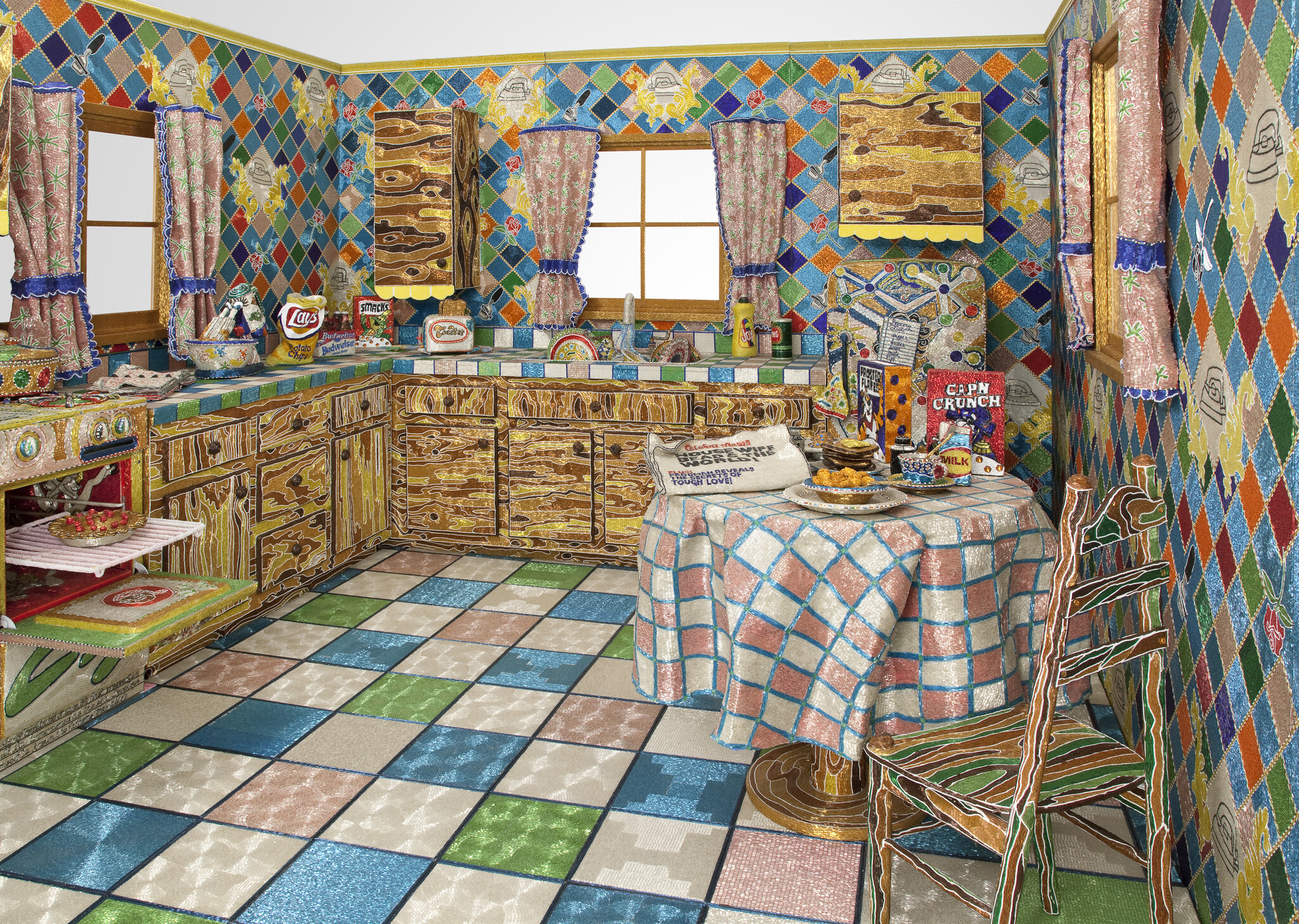 Colorful kitchen with patterned walls and floor, table set for breakfast, and cereal boxes labeled “Cap’n Crunch” and “Milk.”