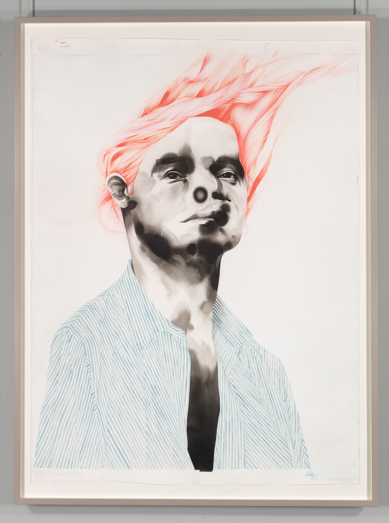 A stylized portrait of a person with exaggerated pink hair flowing upwards, wearing a blue striped shirt. The artwork combines grayscale tones with pops of color and is framed on a wall.