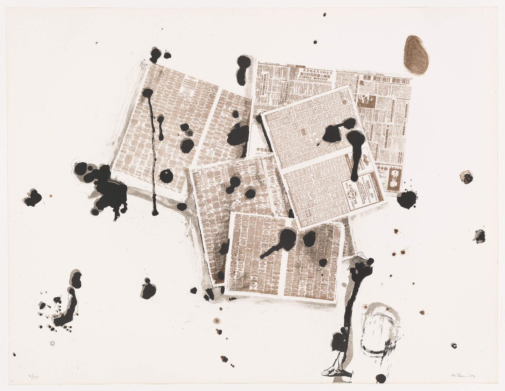 Several folded newspapers scattered on a white surface with large black ink splatters.