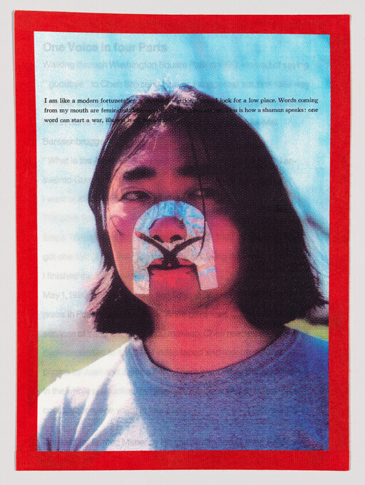 Young person with decorative taped symbol covering nose and mouth, looking straight ahead.