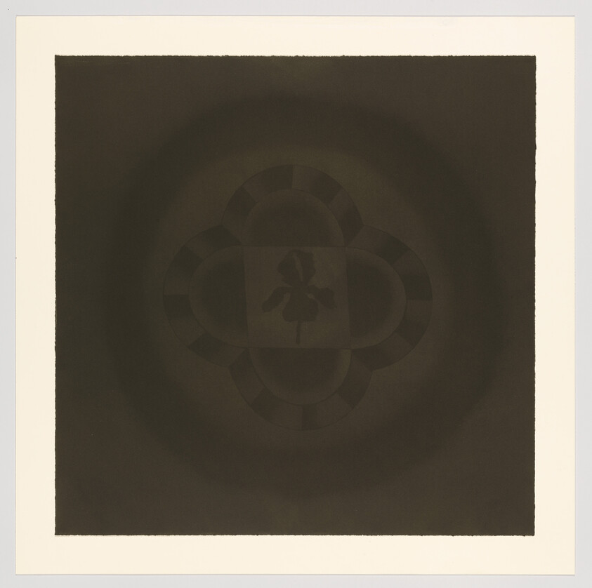 A dark square print showing a faint quatrefoil pattern with a small flower silhouette at center.