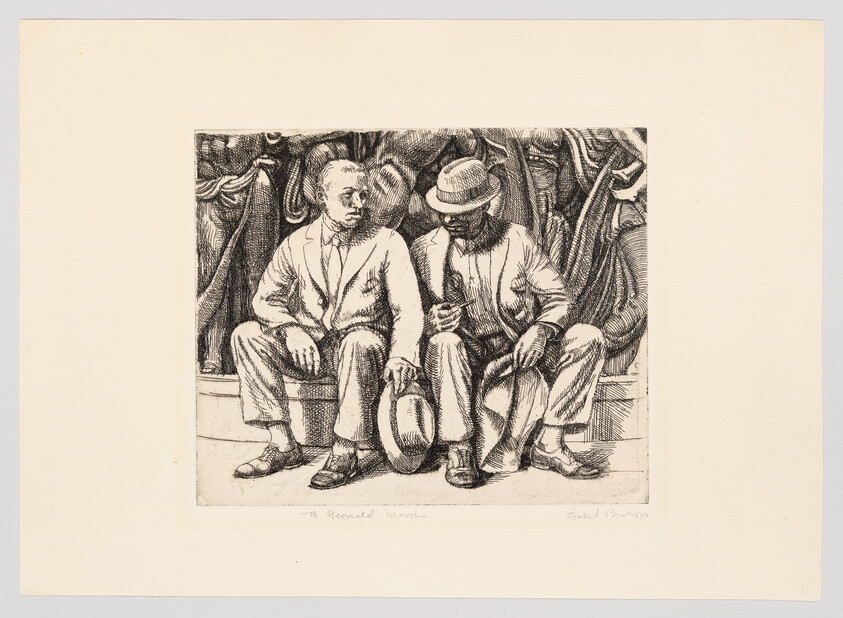 Two men in suits sit on a bench, one holding his hat, the other inspecting a small object.