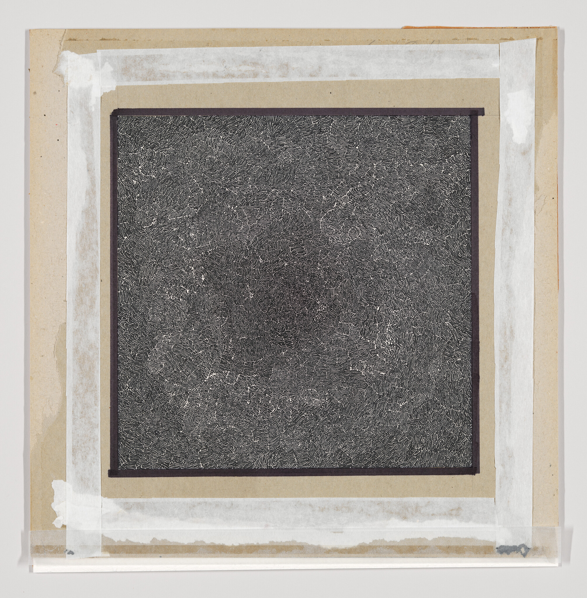 A densely scribbled abstract drawing with a black background and white lines creating a textured appearance, mounted on a beige paper with rough edges and adhesive tape on the corners.