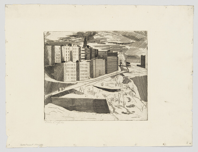 Row of tall apartment buildings along a riverside slope with a winding path below.