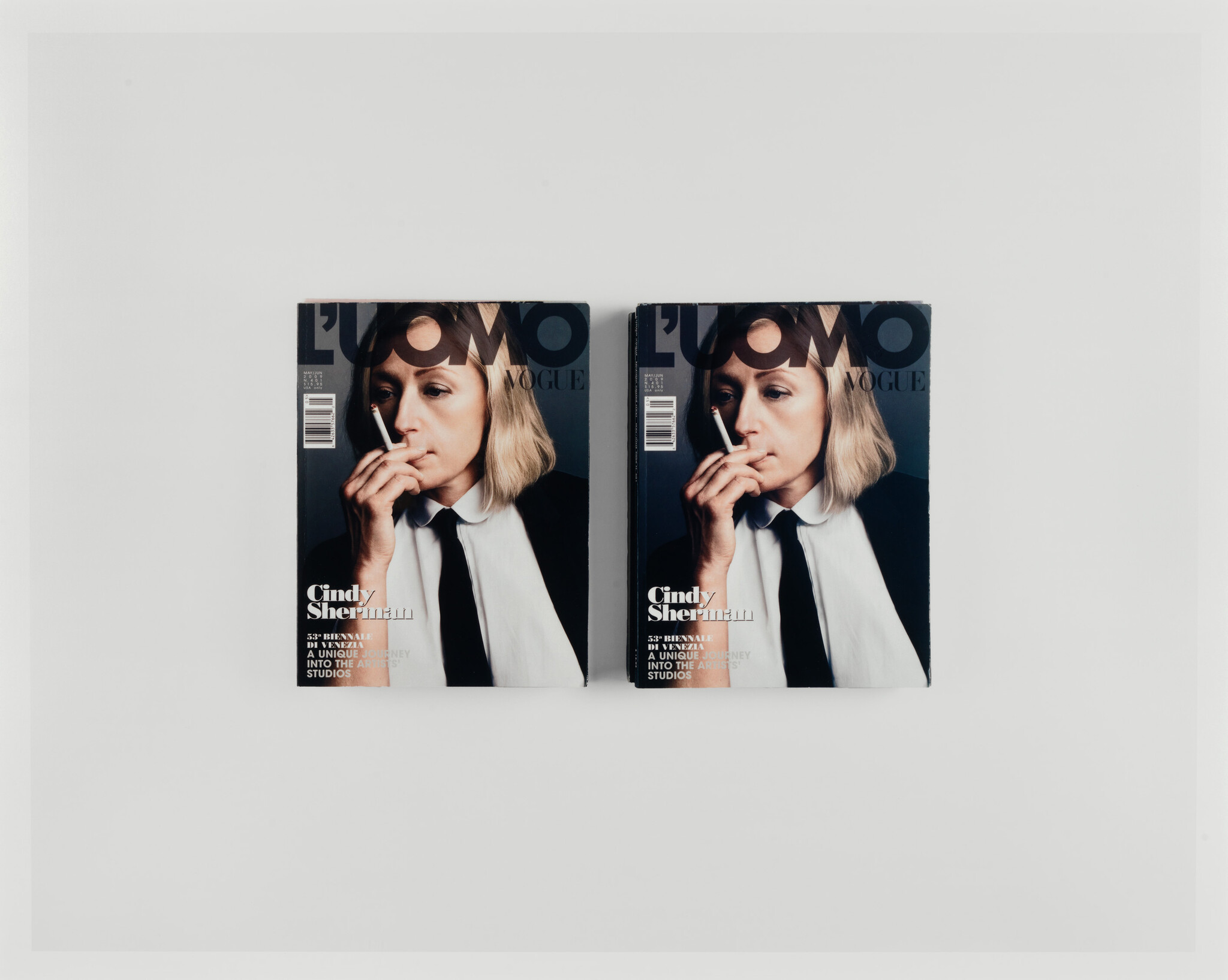 Two magazine covers showing a woman holding a cigarette to her mouth.
