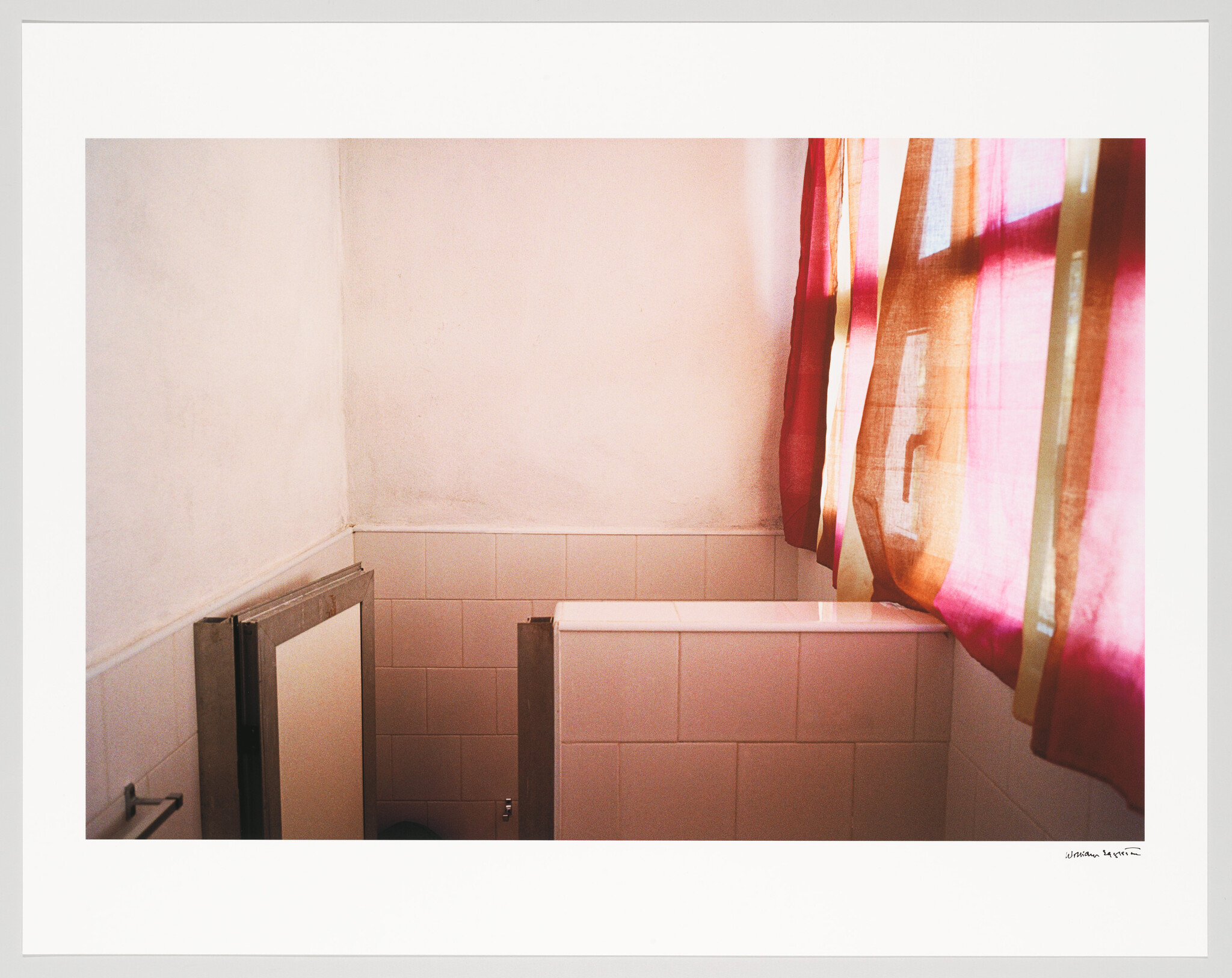 Sunlight filters through pink curtains onto tiled restroom stalls and pale bathroom walls.