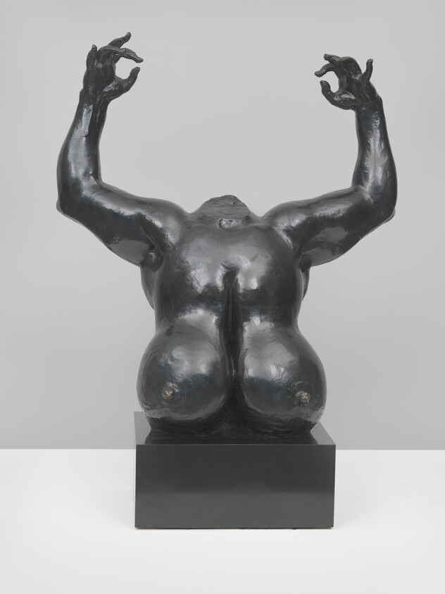 Black bronze torso sculpture with raised arms and expressive hands on a square base.