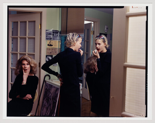 Teen applies lipstick in front of a mirror while an older woman watches with a surprised expression.