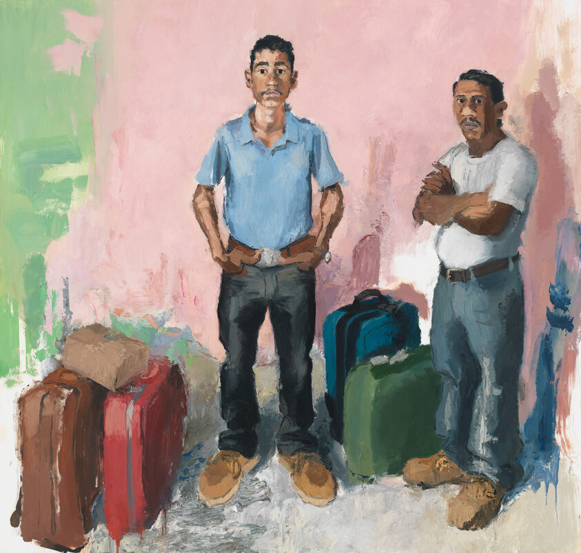 Two men stand with luggage against a painted wall, looking directly ahead.