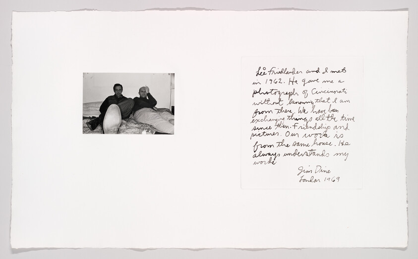 Two people reclining in a small black-and-white photo beside a handwritten note dated London 1969.