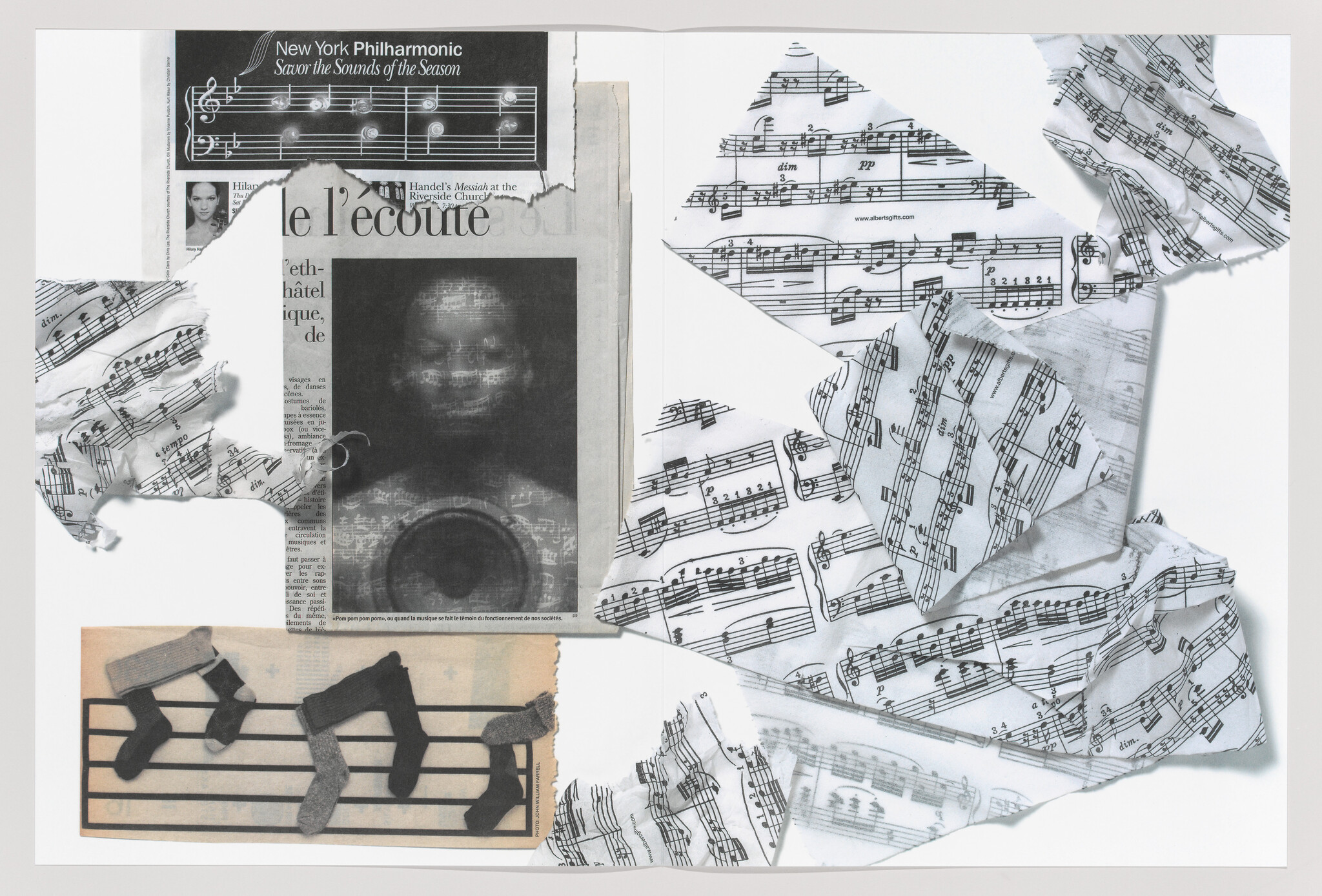 Torn and crumpled sheet music and newspaper clippings arranged on a white background.