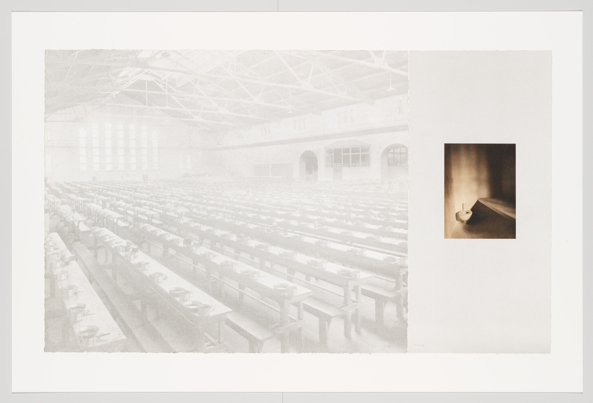 Empty industrial dining hall with long rows of benches and bowls and small solitary basin inset.