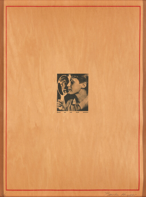 A young person holds a hand mirror and looks at their reflection centered on a large wooden panel.