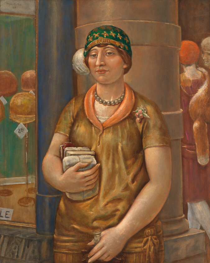 A woman in a green cloche hat stands holding folded books and a small bottle.