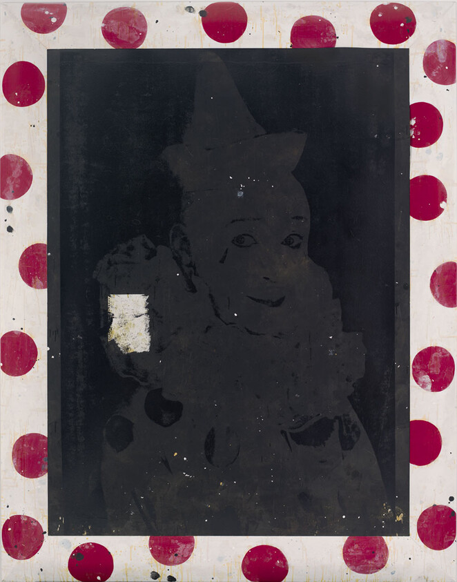 Faded portrait of a smiling clown wearing a cone hat framed by a red polka-dot border.