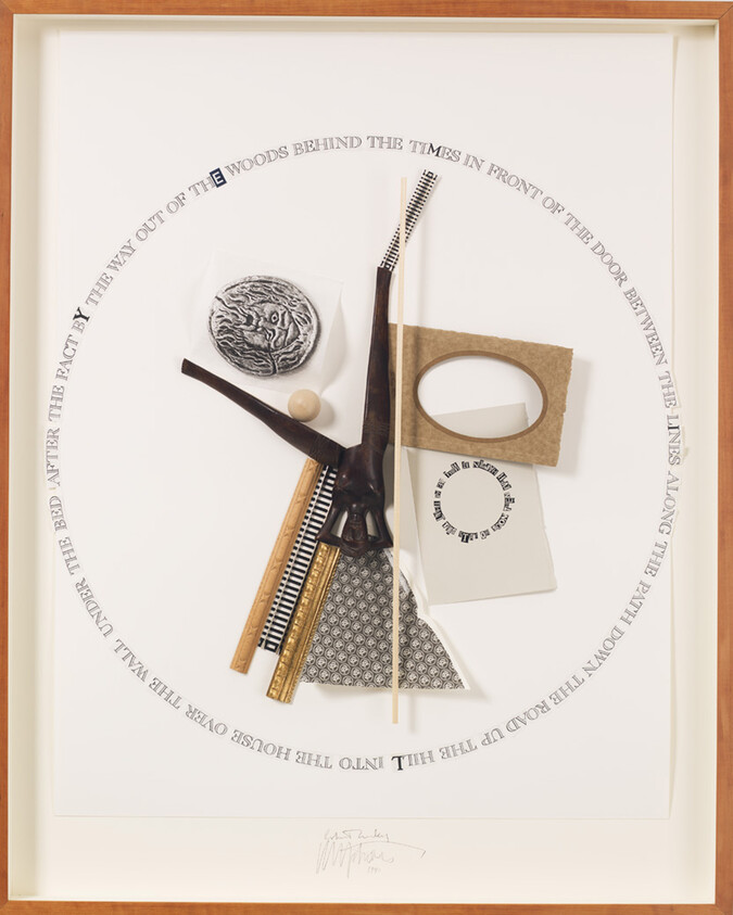 Mixed-media collage with carved wooden pieces, rulers, paper cutouts and circular text around the composition.