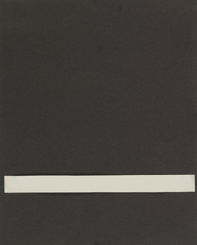 A plain dark sheet with a long white horizontal strip centered near the bottom.