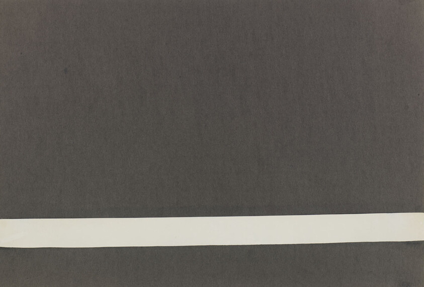A dark gray textured background with a long white horizontal strip across the lower portion.