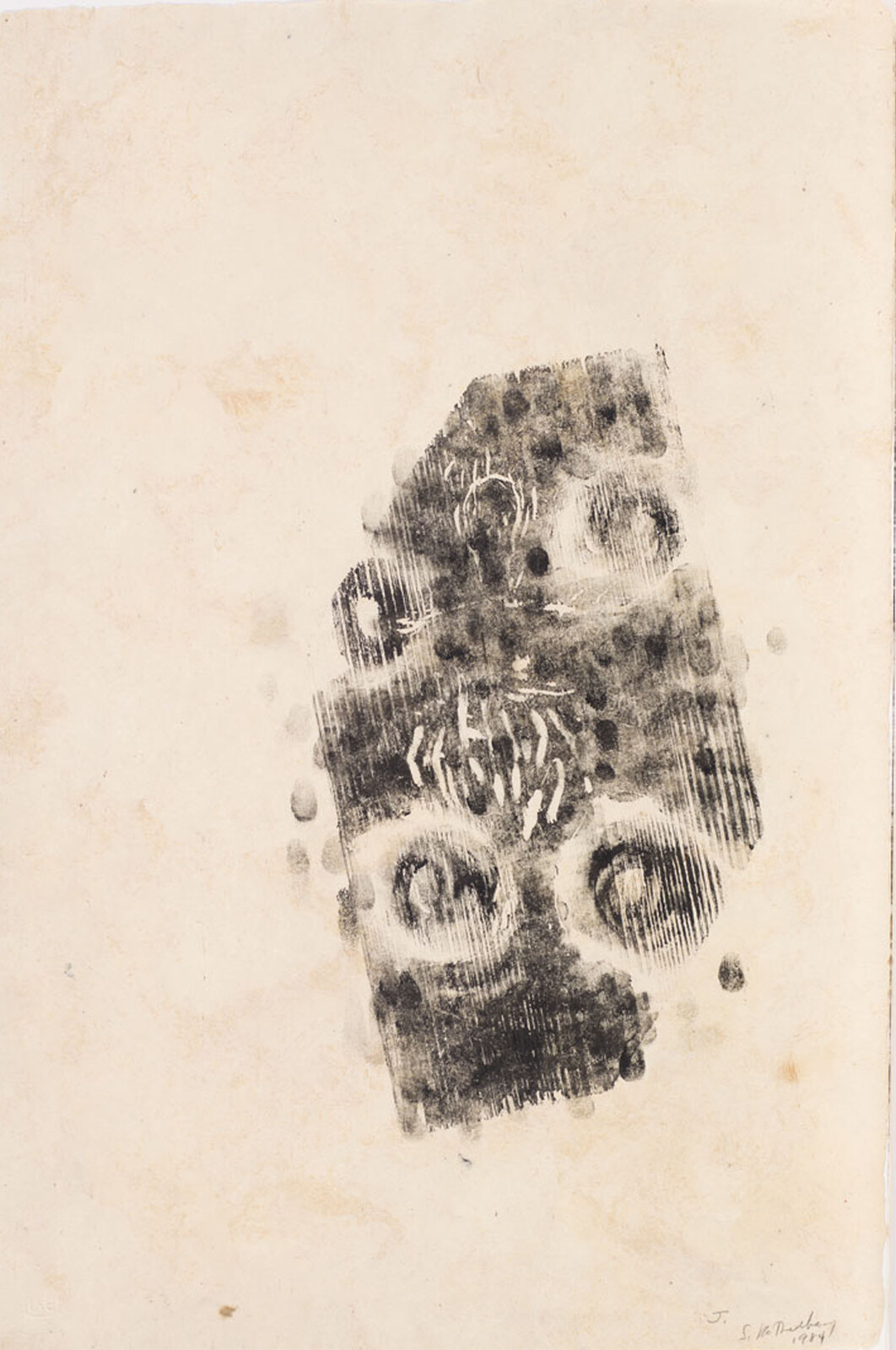 Abstract black ink print resembling a mask with round eye shapes on aged paper.