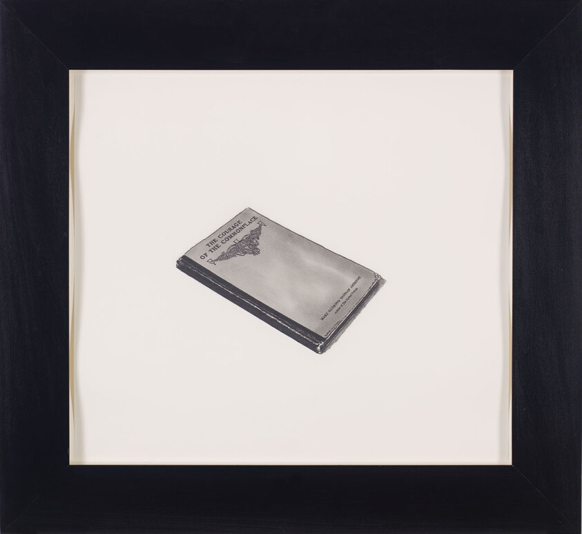 A framed black and white drawing of a book titled "The Courage of the Commonplace."