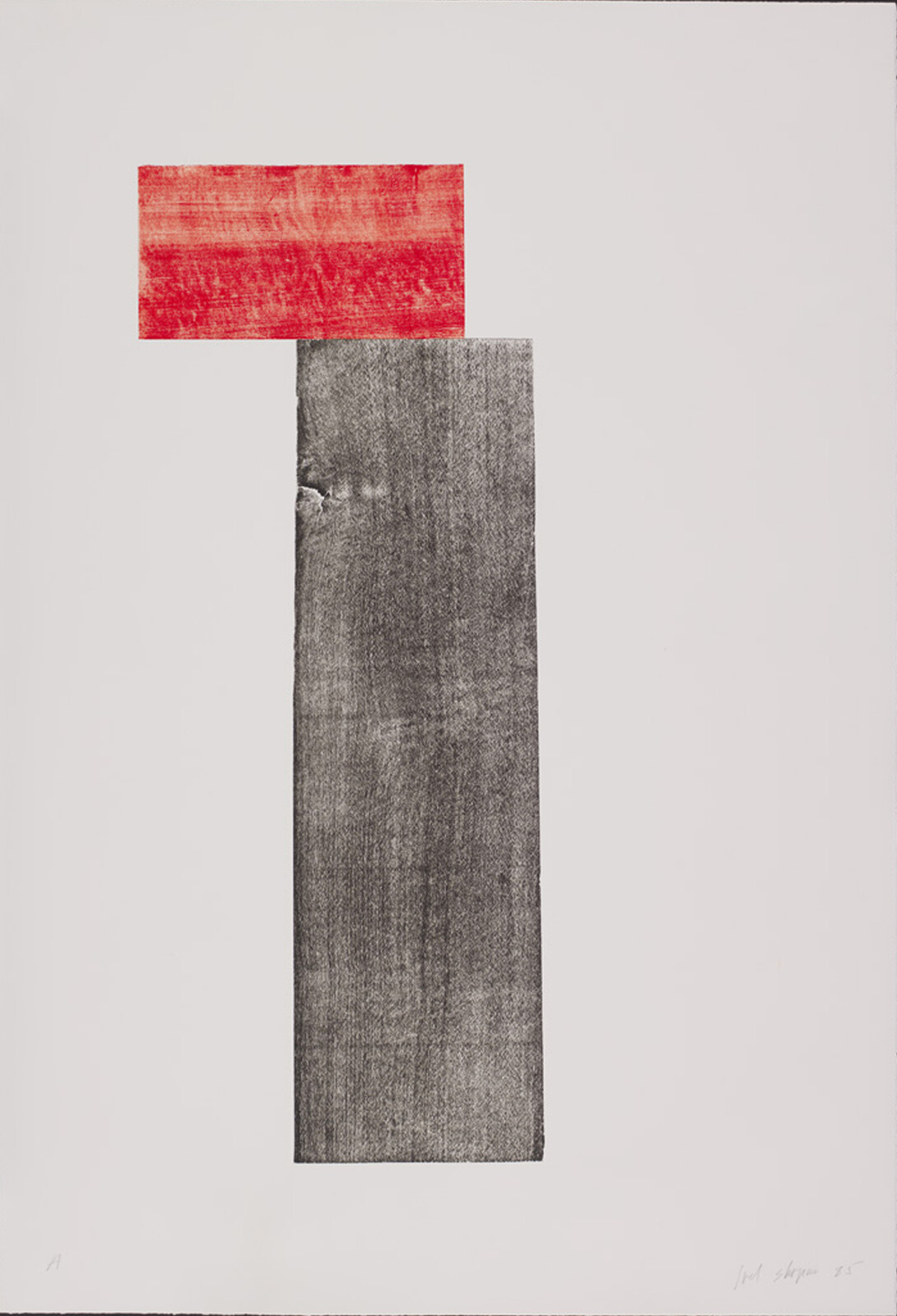 A red rectangle sits atop a tall, textured black rectangle on a plain background.