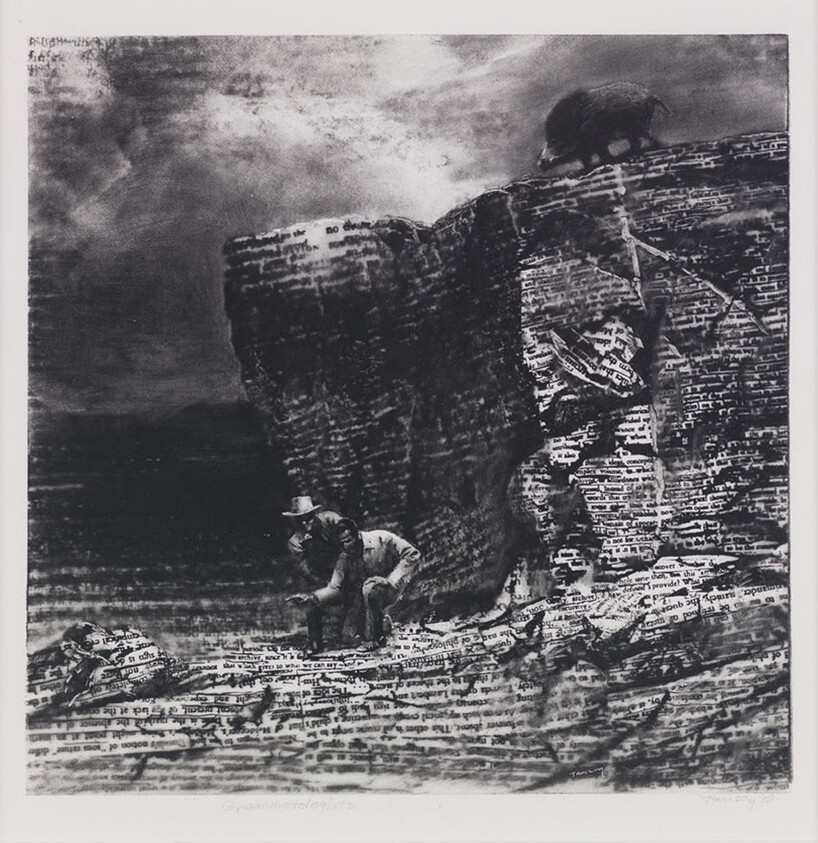 Two people examine a rocky cliff covered in text, with an animal standing on top.