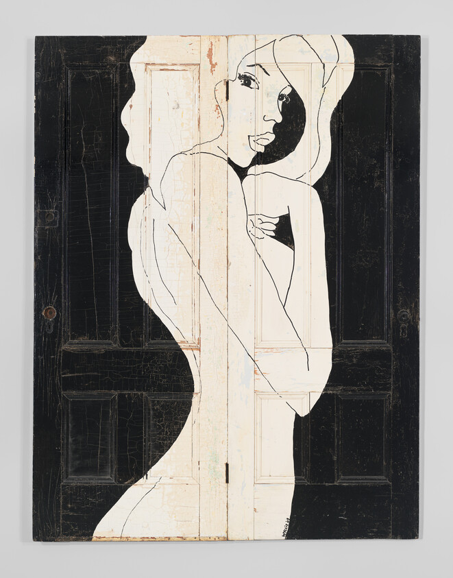 A minimalist black-and-white silhouette of a woman painted across two old wooden doors.