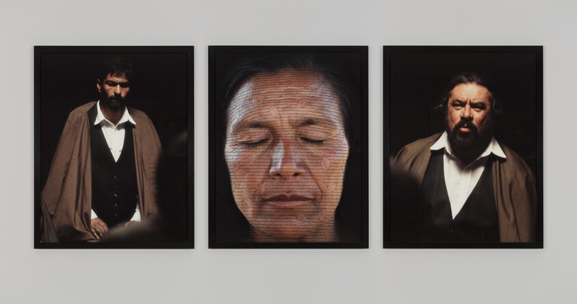 Three framed portraits: two men in brown capes on either side, and a woman with closed eyes in the center.