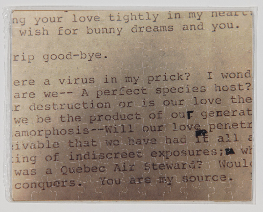 Typewritten text printed across assembled jigsaw puzzle pieces with a few ink smudges.