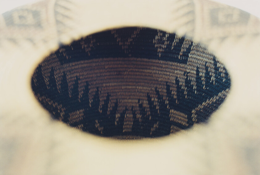 Close-up of a knitted fabric with a blurred pattern, creating an abstract texture.
