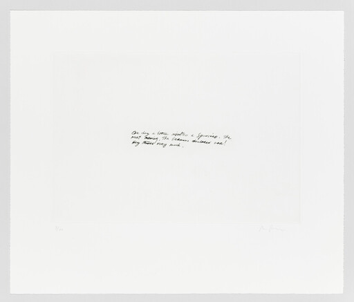 A small handwritten note appears centered on a large white sheet of paper.