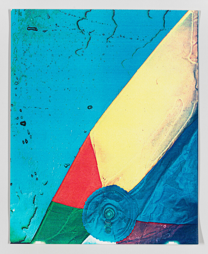 Colorful abstract art with geometric shapes and textured blue background.