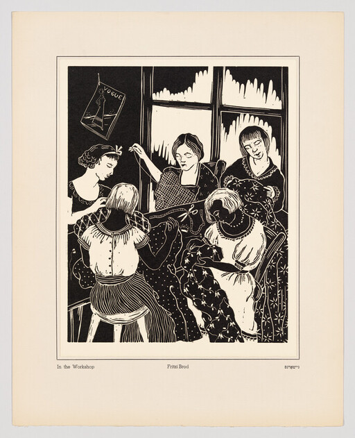 Five women sit together in a sewing workshop, cutting and stitching fabric by a window.