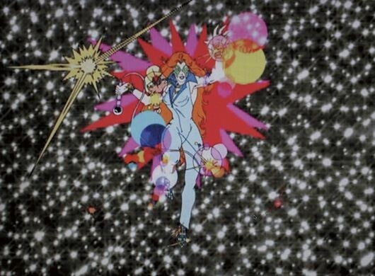 A red-haired animated woman strikes a magical pose surrounded by colorful bubbles and stars.