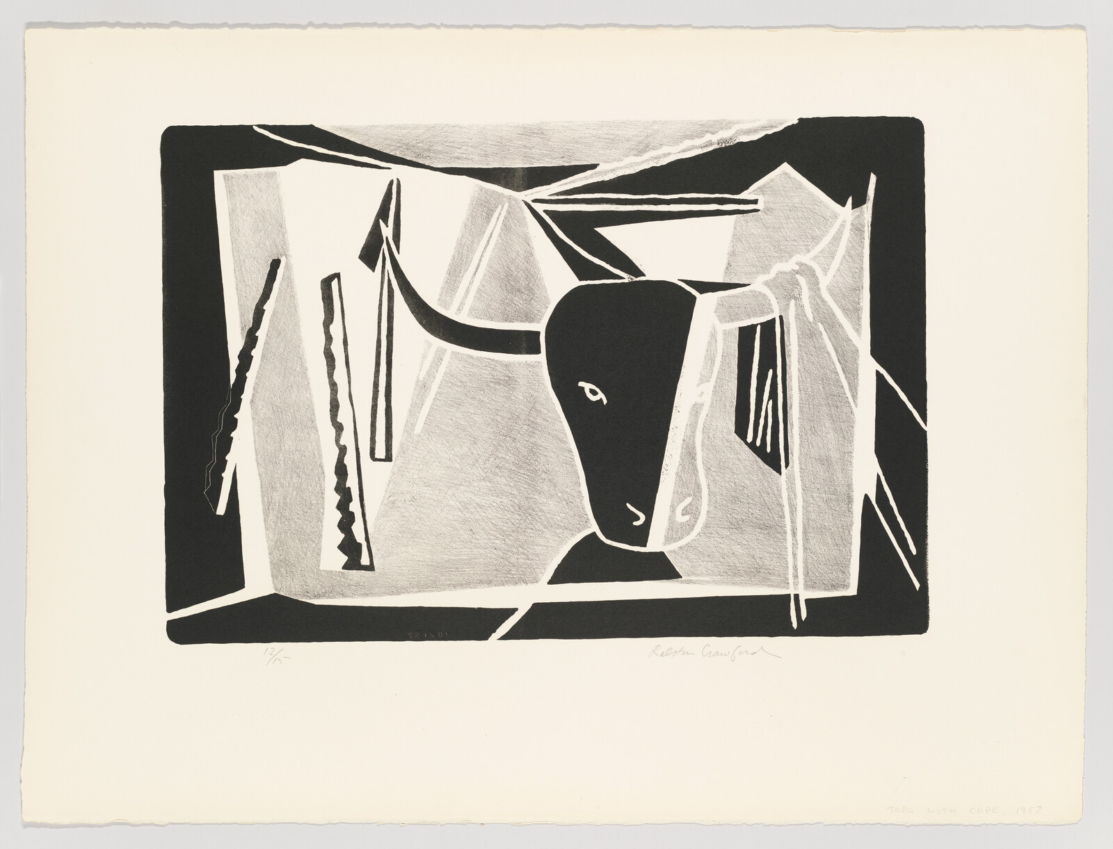 A bold black-and-white print showing a bull's head with long horns inside a rectangular frame.