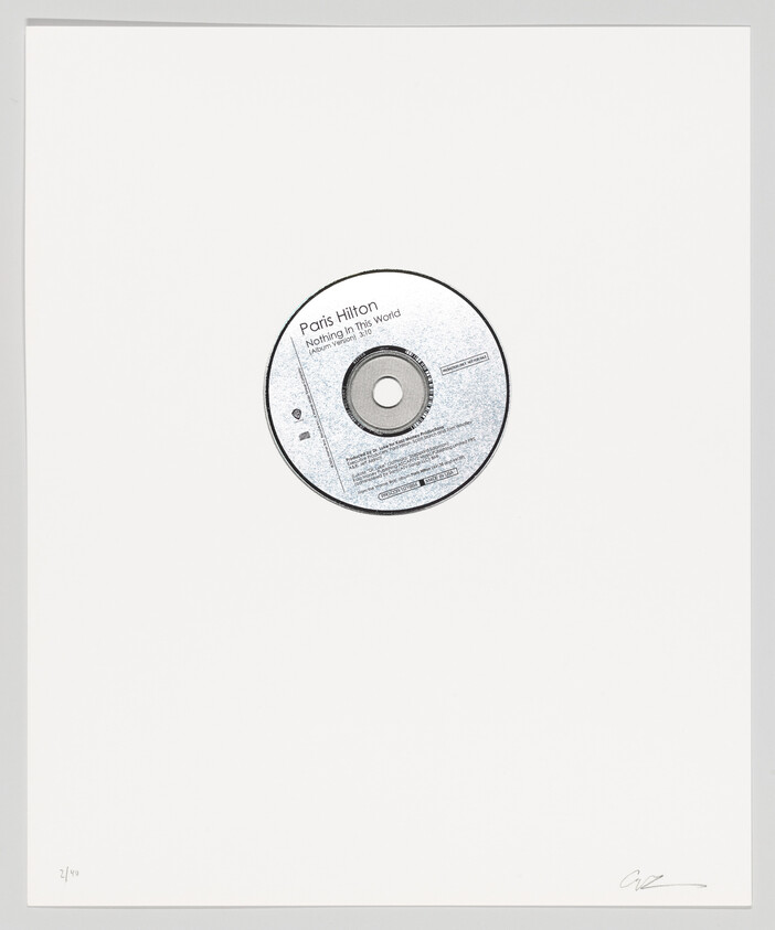 A compact disc labeled "Paris Hilton Nothing in This World" is centered on a white background with a signature and edition number at the bottom.