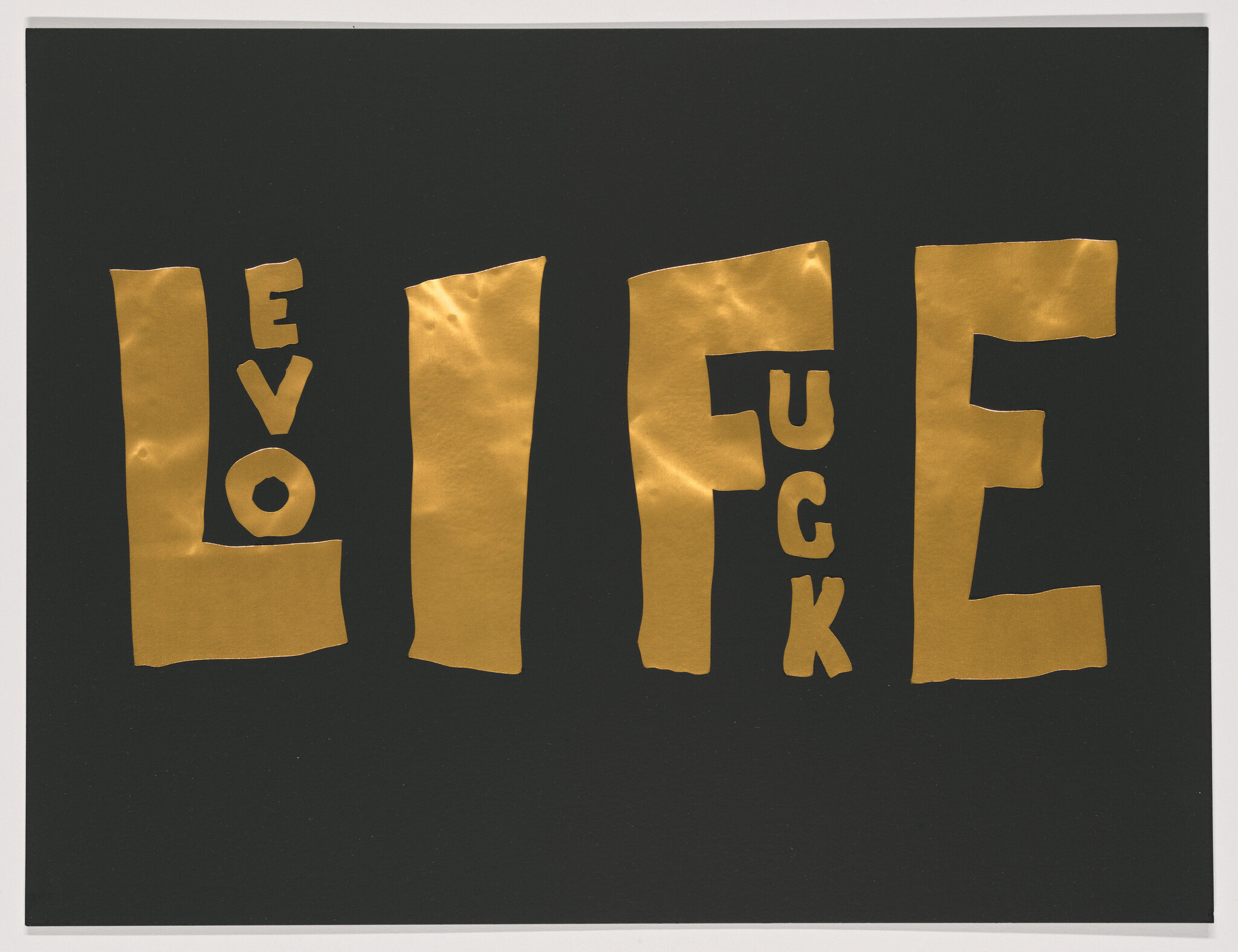 Gold cutout letters spell the word "Life" against a black background.