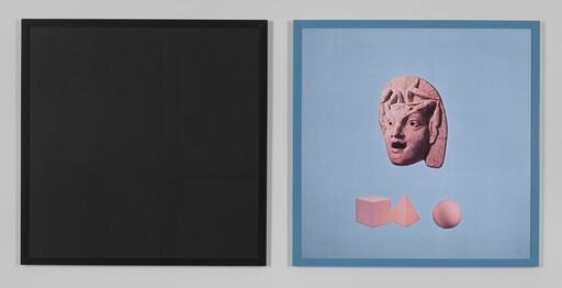Two framed artworks on a wall: a black square and a blue panel with a pink carved head and shapes.