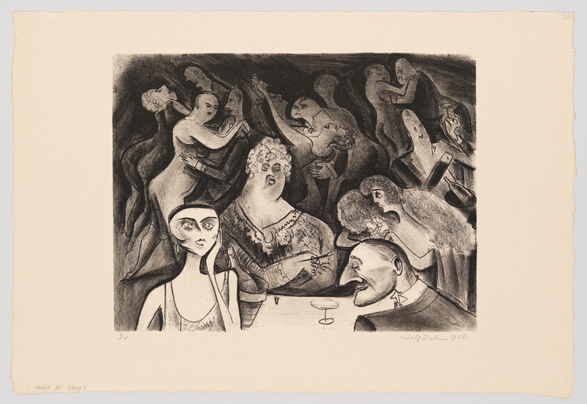 A young woman and others sit at a table while dancers swirl behind them.