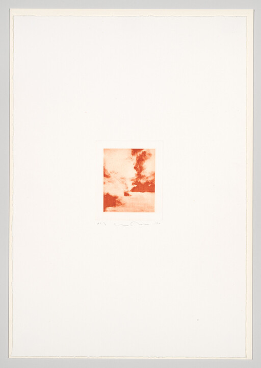 A small red-orange cloud print is centered on a large white sheet of paper.